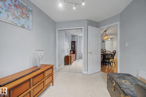 Neutral-toned walls complement the light-colored carpet flooring - 308 10933 124 Street, Edmonton, AB 