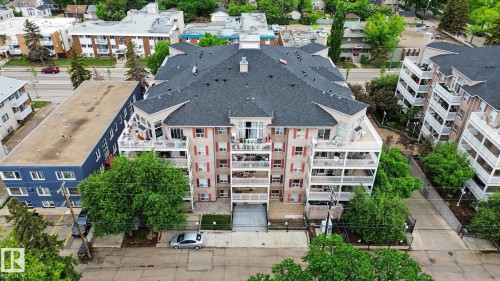 Multi-story residential building featuring balconies and a dark asphalt shingle roof - 308 10933 124 Street, Edmonton, AB 