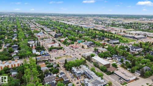 Aerial perspective showcasing an urban landscape with established tree-lined streets - 308 10933 124 Street, Edmonton, AB 