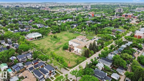 Expansive aerial perspective showcasing a vibrant urban landscape with extensive tree canopy - 308 10933 124 Street, Edmonton, AB 