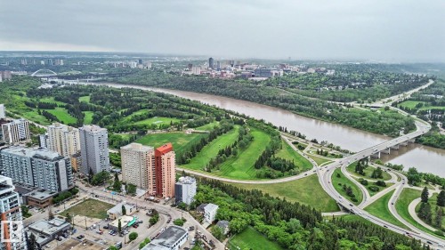 Expansive urban landscape featuring high-rise buildings, a river, and multiple bridges - 308 10933 124 Street, Edmonton, AB 