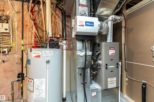 Mechanical room featuring a water heater, furnace, and humidifier - 115 57 Street, Edmonton, AB 