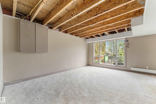 Lower level room with exposed wood ceiling joists and subfloor - 35 Oakridge Dr, St. Albert, AB - Indoor Photo Showing Basement