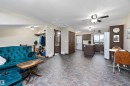 Open-concept living space featuring patterned flooring throughout - 5210 55 Avenue, Wetaskiwin, AB 