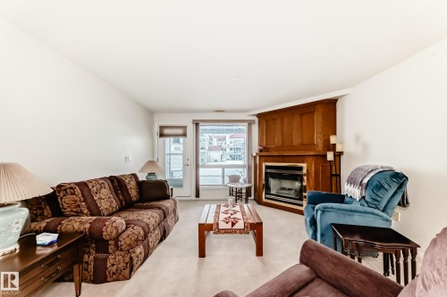 118 6220 Fulton Road, Edmonton, AB - Indoor Photo Showing Living Room With Fireplace