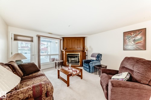118 6220 Fulton Road, Edmonton, AB - Indoor Photo Showing Living Room With Fireplace