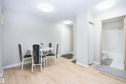 Light wood-finish flooring extending through living areas - 