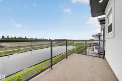 Private balcony featuring a concrete surface and contemporary glass railing - 