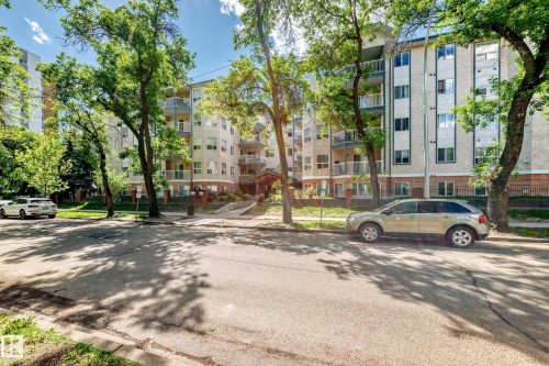 Multi-story residential building featuring a light-colored facade with contrasting vertical window sections - 214 9938 104 Street, Edmonton, AB 