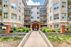Melrose Manor apartment building featuring a stucco exterior with brick accents, multiple private balconies, and a covered main entrance - 
