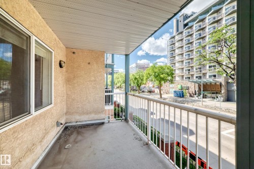 Private balcony featuring a concrete floor and white railing - 214 9938 104 Street, Edmonton, AB 