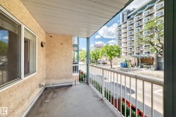 Private balcony featuring a concrete floor and white railing - 