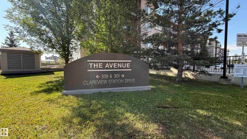 Property signage for "THE AVENUE" with directional arrows for addresses 309 and 301 Clareview Station Drive - 133 301 Clareview Station Drive, Edmonton, AB 