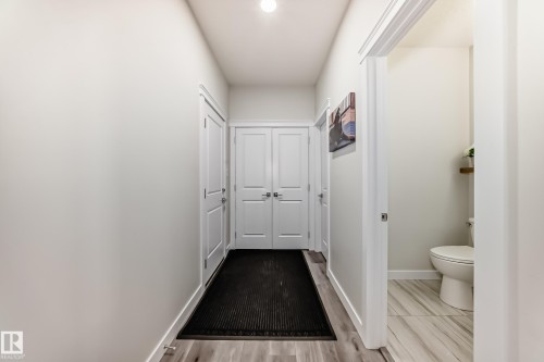 Entryway featuring wood-finish flooring and light-toned walls - 589 Boulder Wynd, Leduc, AB - Indoor Photo Showing Other Room
