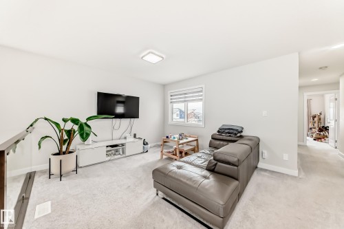 Carpeted upper-level bonus room with neutral wall paint - 589 Boulder Wynd, Leduc, AB - Indoor Photo Showing Other Room