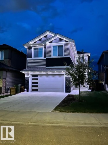 Contemporary two-story exterior featuring a grey and dark blue façade with white trim - 589 Boulder Wynd, Leduc, AB - Outdoor