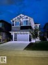 Contemporary two-story exterior featuring a grey and dark blue façade with white trim - 589 Boulder Wynd, Leduc, AB  - Outdoor 