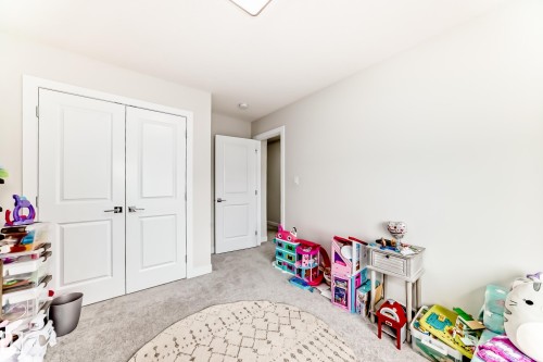 Recessed lighting illuminates this room, featuring light gray carpeting and white walls - 589 Boulder Wynd, Leduc, AB - Indoor