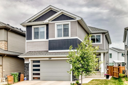 Two-story residential exterior featuring a light gray and dark blue siding facade - 589 Boulder Wynd, Leduc, AB - Outdoor