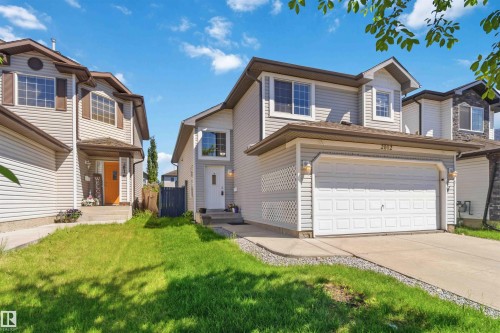 Two-story residence featuring light-colored siding and a contrasting brown roof - 2012 35A Avenue, Edmonton, AB 