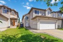 Two-story residence featuring light-colored siding and a contrasting brown roof - 2012 35A Avenue, Edmonton, AB 