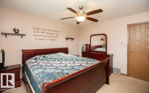 Interior room featuring light pink walls and neutral carpeting - 57532 Rg Rd 270, Rural Westlock County, AB 