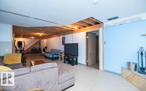 Lower level space with exposed ceiling joists and partial finished drywall - 57532 Rg Rd 270, Rural Westlock County, AB 