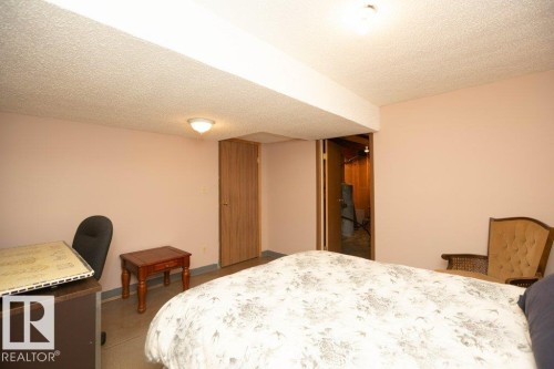 Carpeted room with a textured ceiling and a neutral wall color - 57532 Rg Rd 270, Rural Westlock County, AB 