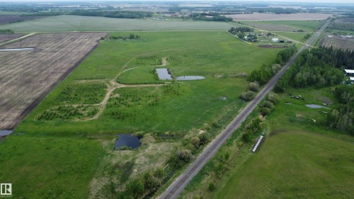Expansive rural property featuring cultivated fields, natural ponds, and established tree lines - 57532 Rg Rd 270, Rural Westlock County, AB 