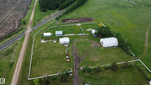 Expansive rural property featuring multiple outbuildings, white perimeter fencing, and a main residential structure - 57532 Rg Rd 270, Rural Westlock County, AB 