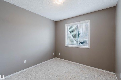 Neutral-toned room with light-colored carpeting - 38 1780 Glastonbury Boulevard, Edmonton, AB 