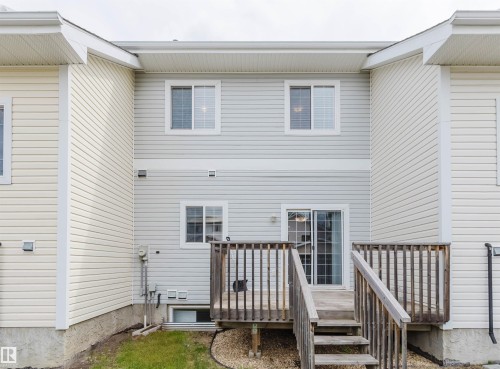 Multi-level rear deck with wood railing - 38 1780 Glastonbury Boulevard, Edmonton, AB 