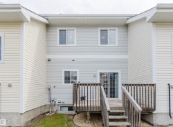 Multi-level rear deck with wood railing - 