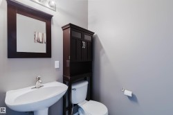 Pedestal sink featuring a chrome faucet - 