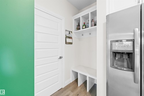 Integrated built-in mudroom bench with cubbies and upper storage - 389 Charlesworth Drive, Edmonton, AB 