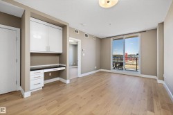 Open-concept living area with light wood-finish flooring - 