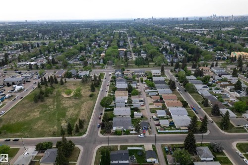 Aerial perspective highlighting a verdant residential area with mature tree-lined streets - 7304/7306 78 Avenue, Edmonton, AB 
