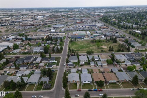 Aerial view showcasing residential properties with gray and brown shingle roofs - 7304/7306 78 Avenue, Edmonton, AB 