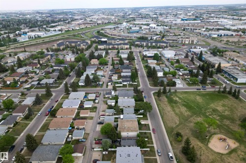Aerial perspective showcasing an established residential area with mature tree-lined streets - 7304/7306 78 Avenue, Edmonton, AB 