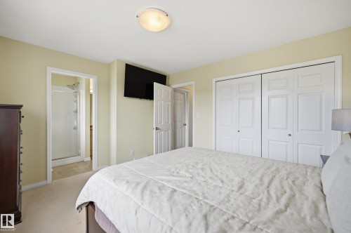 Bedroom featuring soft wall color, recessed lighting, carpet flooring, and white bi-fold closet doors - 11628 167A Avenue, Edmonton, AB - Indoor Photo Showing Bedroom