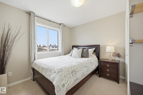Bright bedroom with a single window, neutral wall paint, and beige carpet flooring - 11628 167A Avenue, Edmonton, AB - Indoor Photo Showing Bedroom