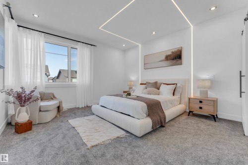 Recessed ceiling lighting, integrated wall and ceiling light strips, and a window with white sheers illuminate the carpeted interior - 206 Linden Loop, Leduc, AB 