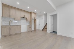 Kitchenette featuring wood-finish cabinetry, white countertops, and a full backsplash - 