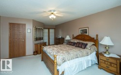 Wall-to-wall carpeting and a ceiling fan with integrated lighting - 