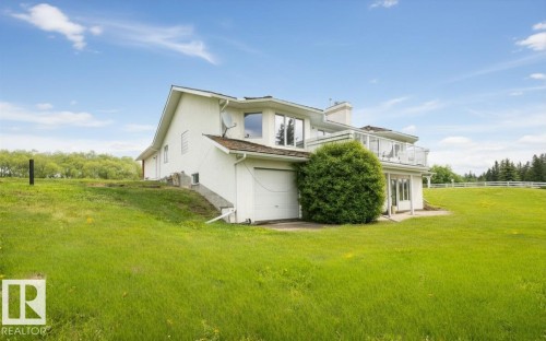 Multi-level residence featuring a white exterior and a walk-out lower level - 60230 Rg Rd 271, Rural Westlock County, AB 