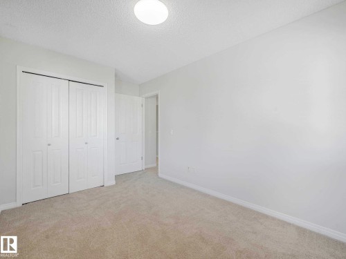 Neutral-toned wall finishes - 77 4050 Savaryn Drive, Edmonton, AB 