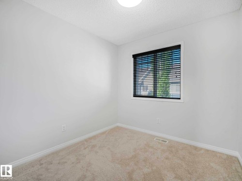 Recessed window with horizontal blinds - 77 4050 Savaryn Drive, Edmonton, AB 