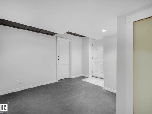 Unfinished room with recessed lighting and exposed ceiling joists - 77 4050 Savaryn Drive, Edmonton, AB 