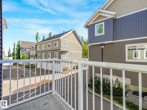 Private balcony featuring white railing and concrete flooring - 77 4050 Savaryn Drive, Edmonton, AB 