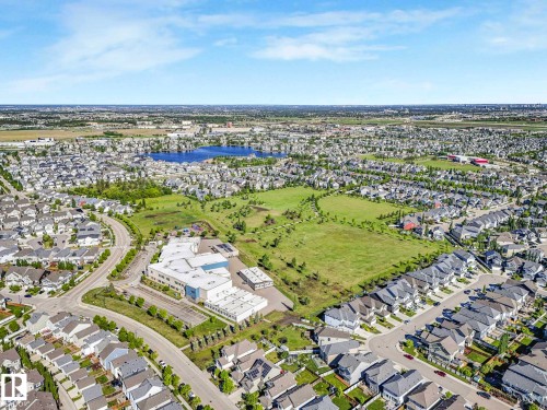 Aerial perspective of a residential community featuring numerous detached homes with varied rooflines - 77 4050 Savaryn Drive, Edmonton, AB 